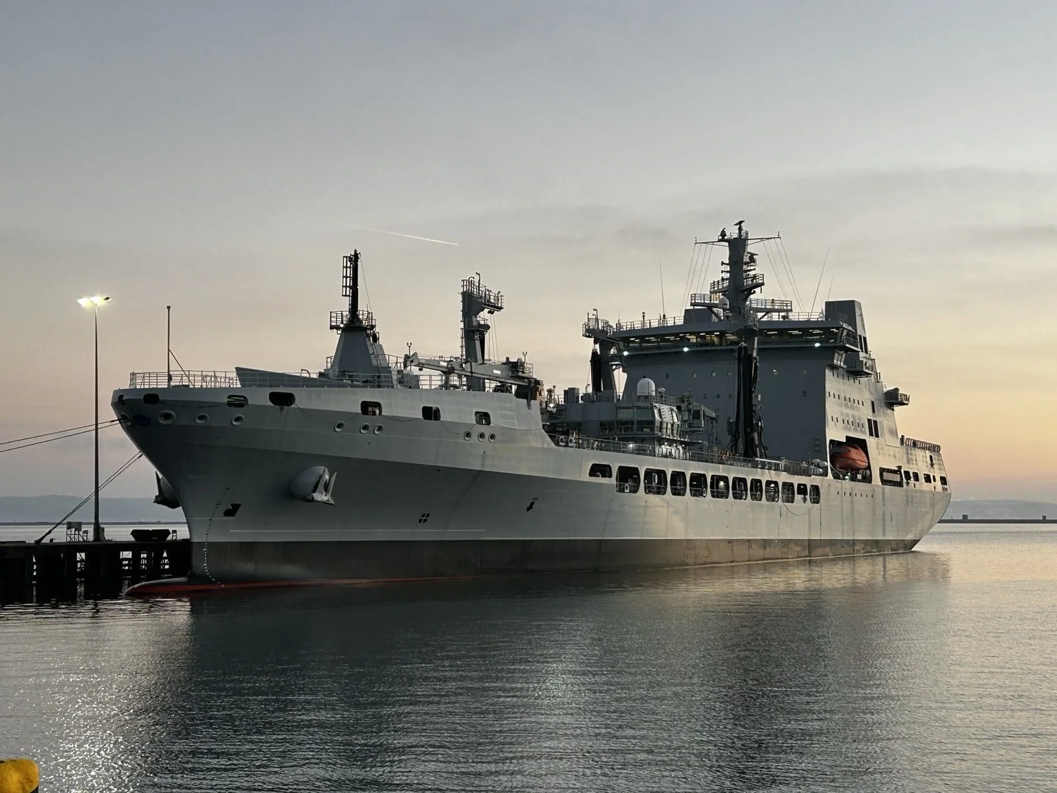 Support vessel alongside at dusk